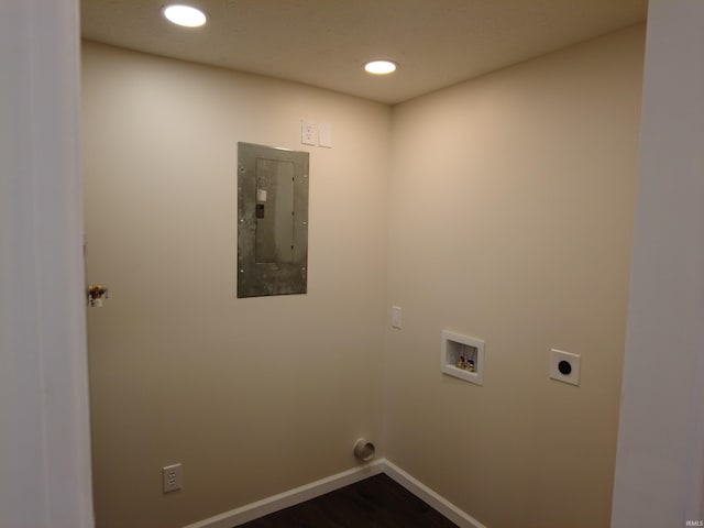 clothes washing area featuring washer hookup, electric panel, dark wood-type flooring, and hookup for an electric dryer