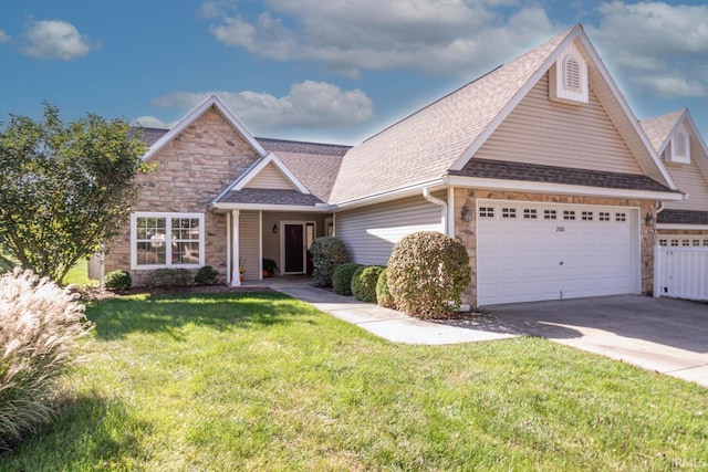 craftsman inspired home featuring a garage and a front lawn