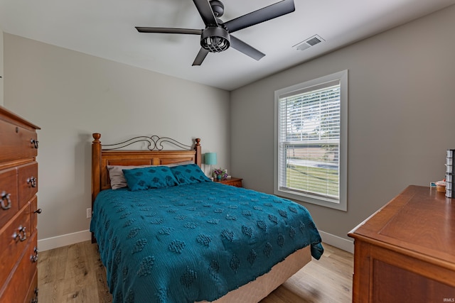 bedroom with ceiling fan and light hardwood / wood-style flooring