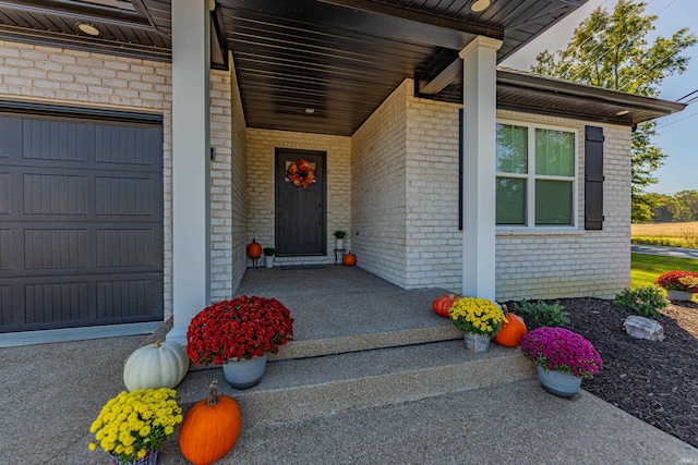 doorway to property featuring a garage