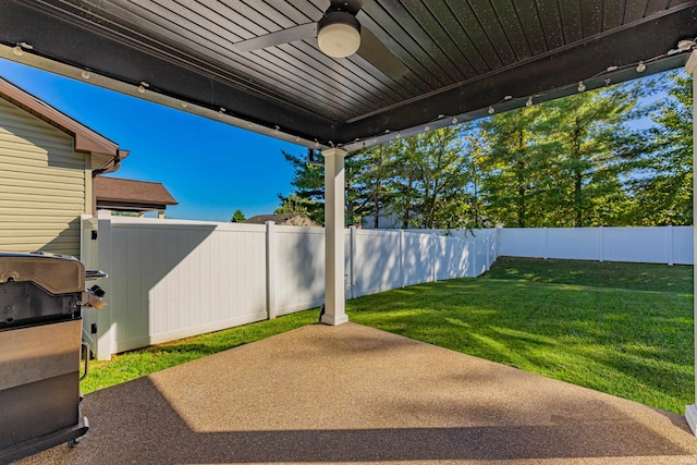 view of patio featuring ceiling fan