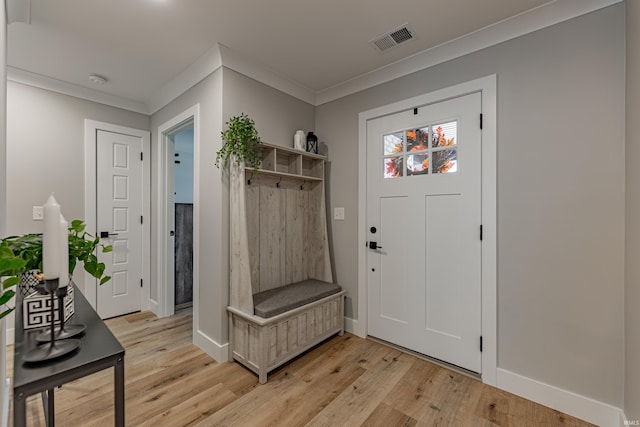 mudroom with crown molding and light hardwood / wood-style floors