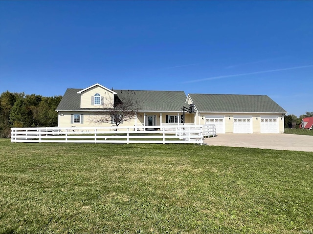 view of front of home with a garage and a front lawn