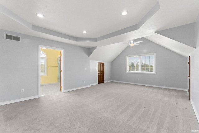 bonus room featuring light carpet, lofted ceiling, and ceiling fan