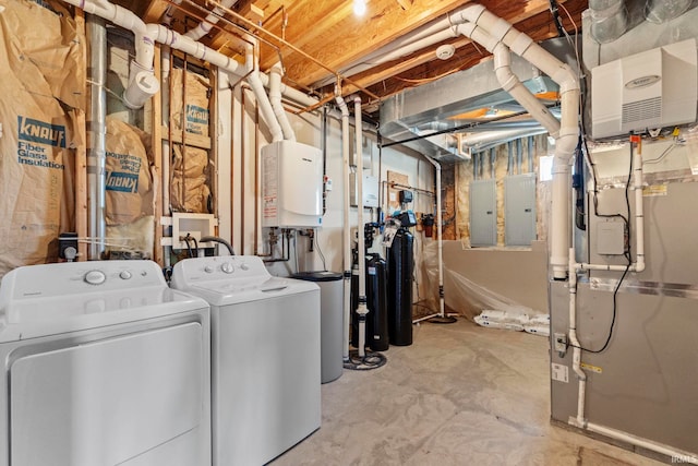 washroom featuring electric panel and separate washer and dryer