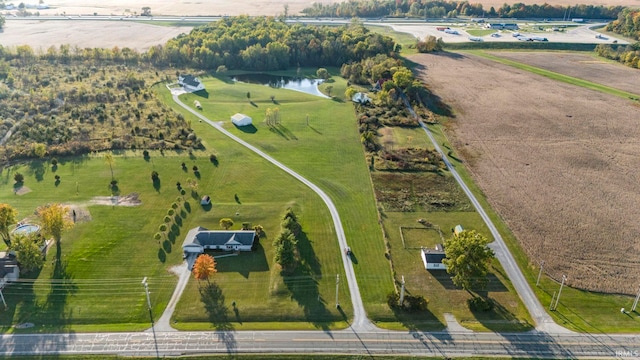 drone / aerial view featuring a water view and a rural view