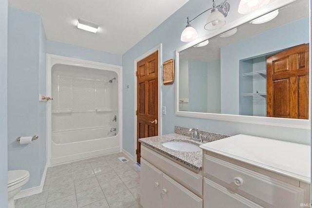 full bathroom featuring tile patterned floors, vanity, washtub / shower combination, and toilet