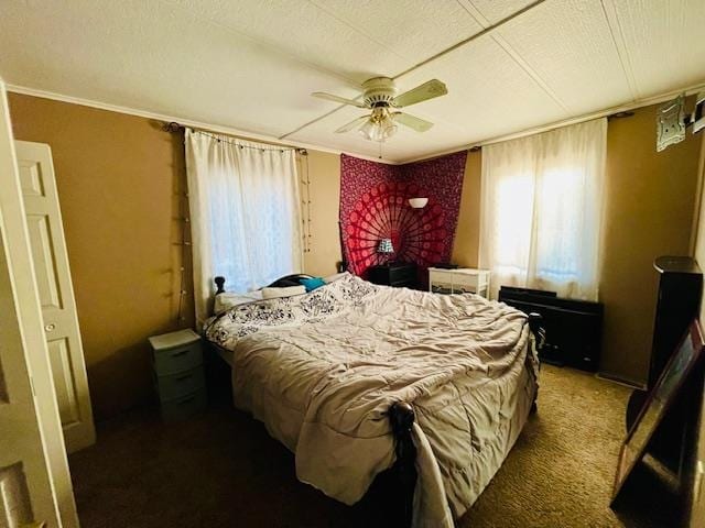 bedroom featuring ceiling fan, carpet floors, and crown molding