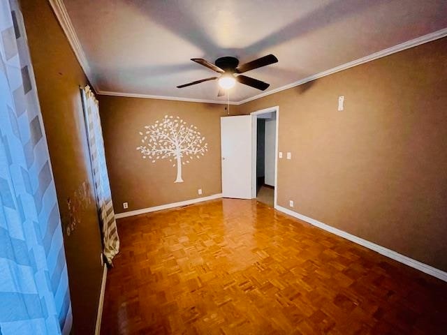 empty room with parquet floors, crown molding, and ceiling fan