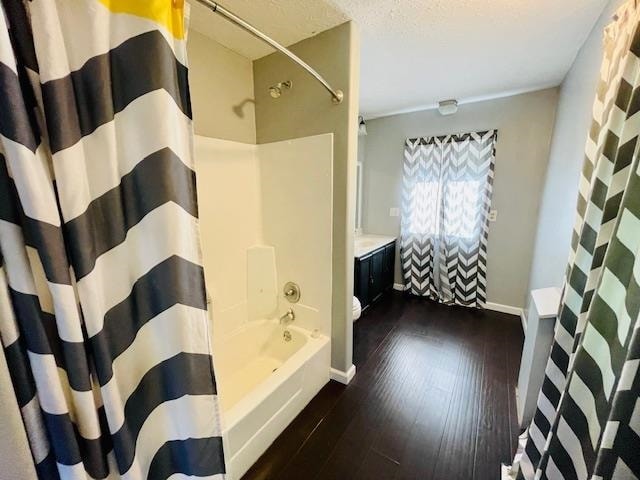 bathroom featuring shower / bath combo with shower curtain, vanity, and wood-type flooring