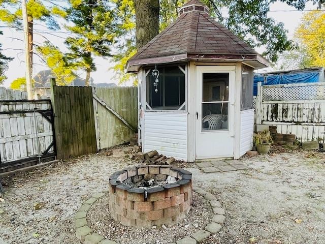 view of outdoor structure with a fire pit