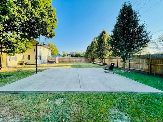 view of basketball court featuring a lawn