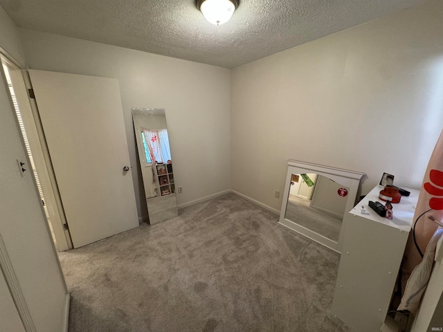 interior space with a textured ceiling