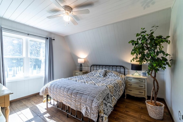 bedroom featuring ceiling fan, vaulted ceiling, and dark hardwood / wood-style flooring