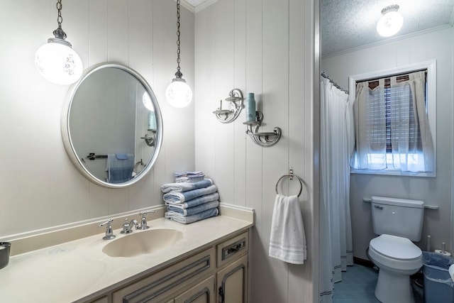 bathroom featuring vanity, tile patterned flooring, ornamental molding, toilet, and a textured ceiling