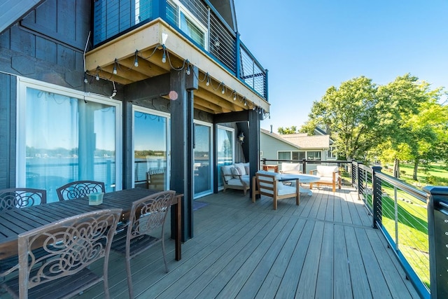 wooden terrace featuring an outdoor living space