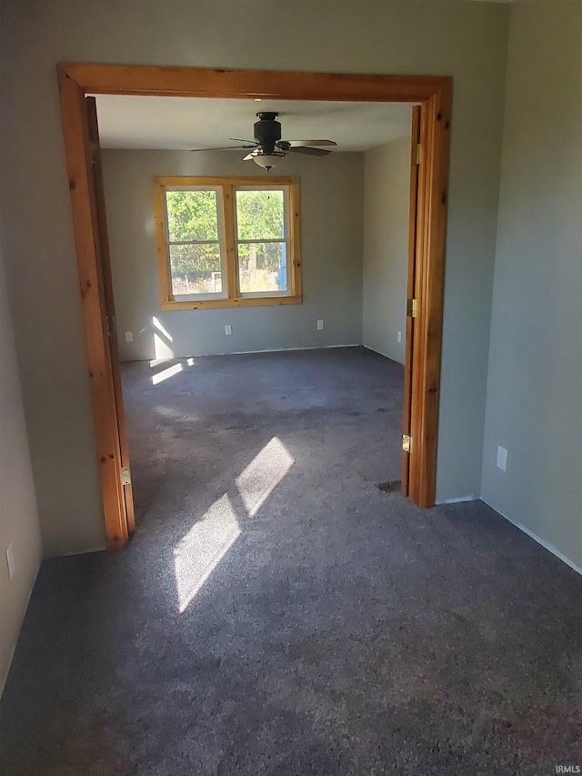 unfurnished room with ceiling fan