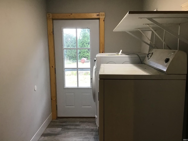 washroom featuring independent washer and dryer and dark hardwood / wood-style floors