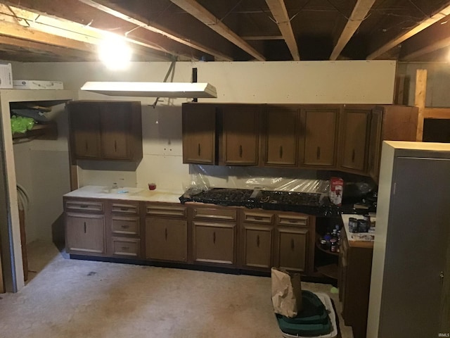 kitchen featuring dark brown cabinetry