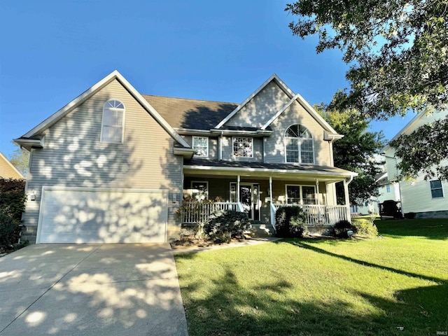 view of front facade with a porch, a garage, and a front lawn