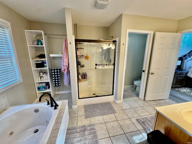 full bathroom featuring tile patterned floors, vanity, toilet, and plus walk in shower