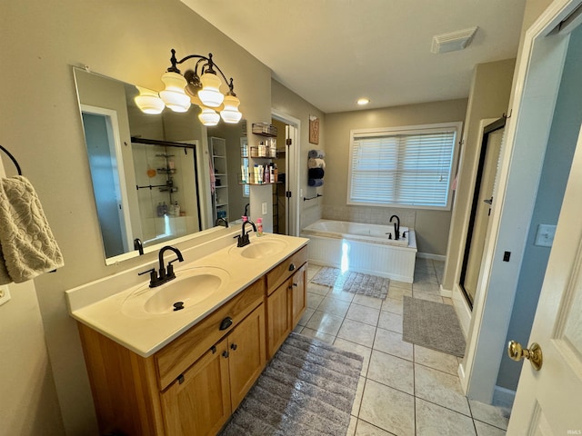 bathroom featuring tile patterned flooring, vanity, a chandelier, and shower with separate bathtub