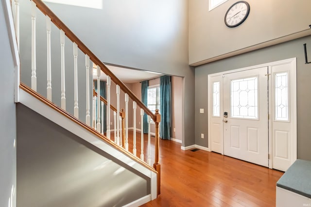 foyer entrance with hardwood / wood-style flooring