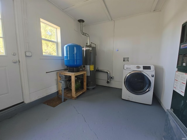 clothes washing area with washer / clothes dryer and water heater