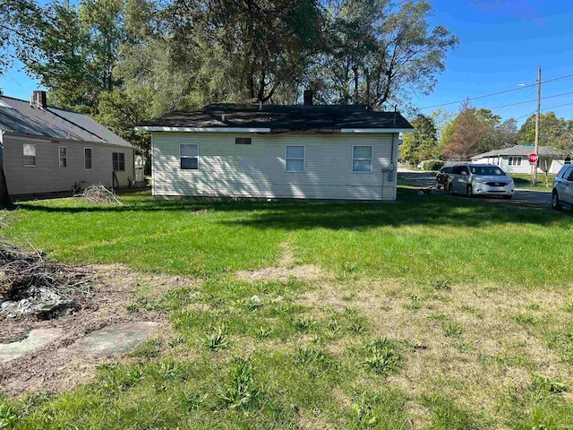 view of property exterior featuring a lawn