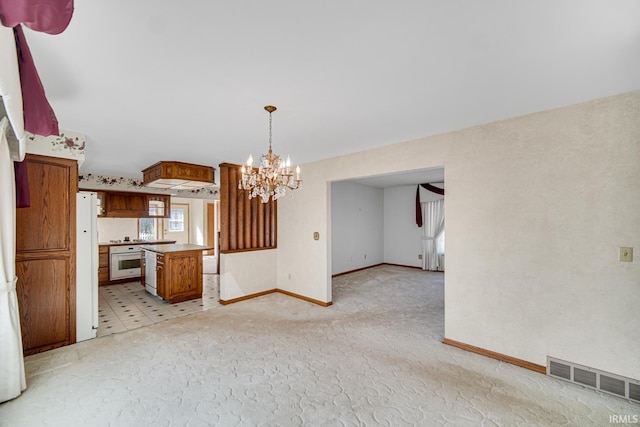 unfurnished living room with a notable chandelier