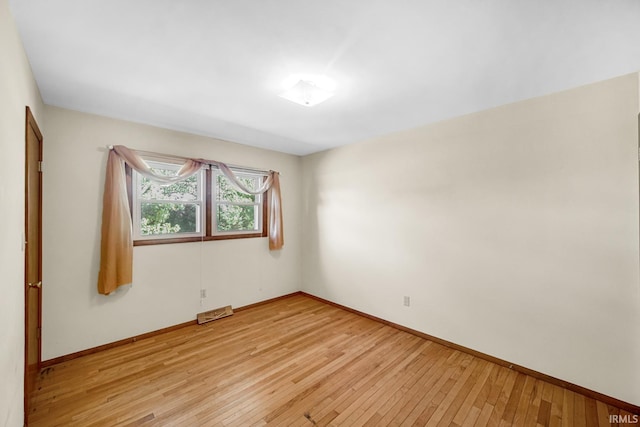 unfurnished room featuring light hardwood / wood-style flooring