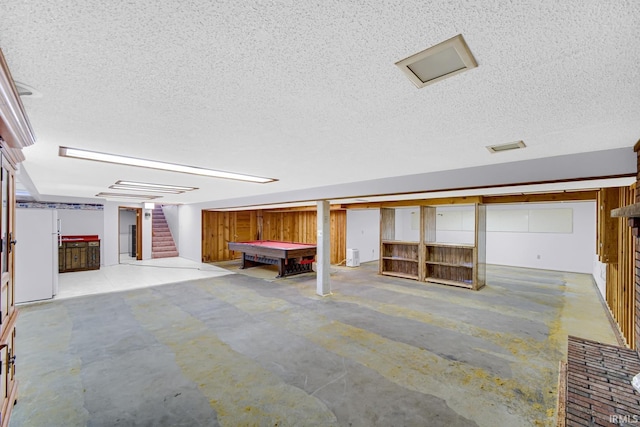 basement featuring a textured ceiling