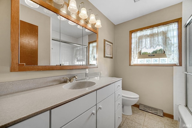 full bathroom featuring vanity, toilet, combined bath / shower with glass door, and a healthy amount of sunlight