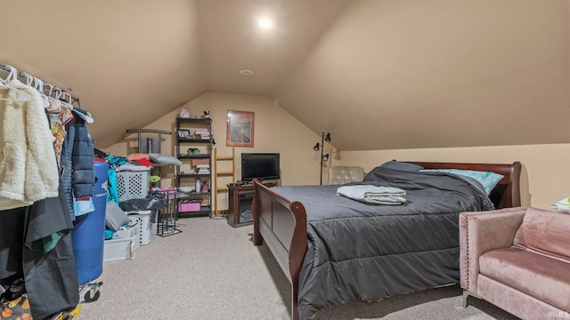 bedroom featuring lofted ceiling and light colored carpet