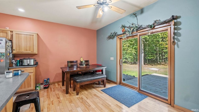 dining space featuring light hardwood / wood-style flooring and ceiling fan