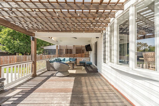 wooden deck with outdoor lounge area and a pergola