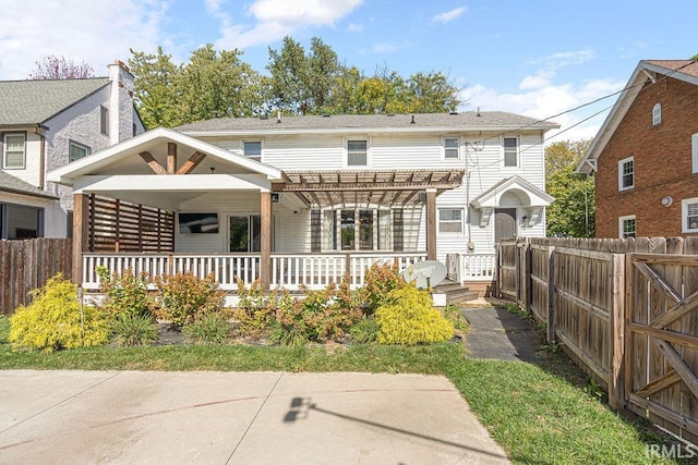 back of property with a pergola and ceiling fan