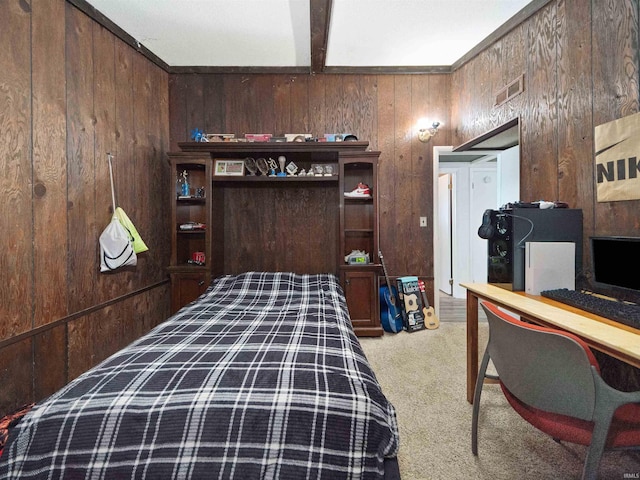 carpeted bedroom featuring beam ceiling and wooden walls