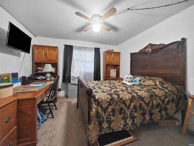 carpeted bedroom with ceiling fan and a textured ceiling