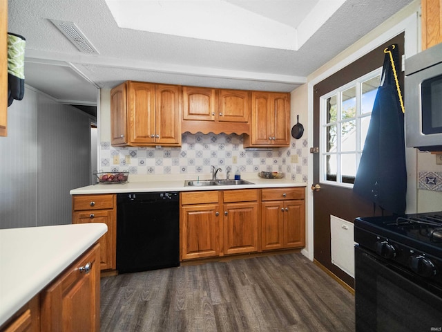 kitchen with black appliances, decorative backsplash, dark wood-type flooring, and sink