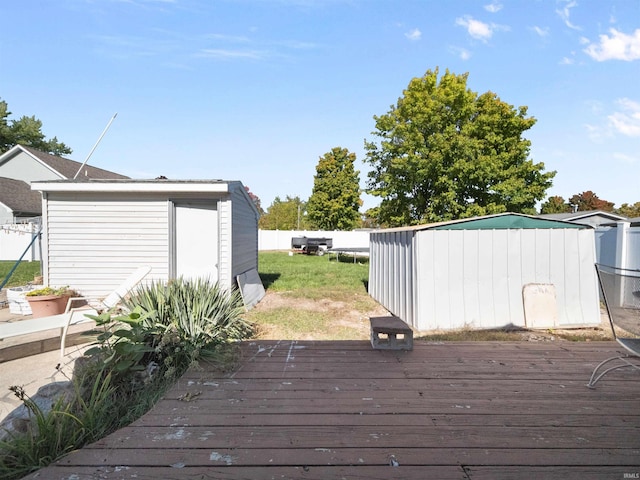 wooden terrace featuring a storage shed