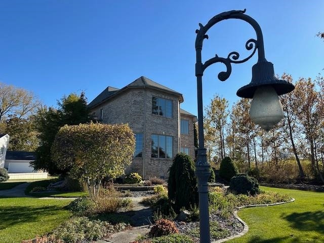 view of home's exterior featuring a yard