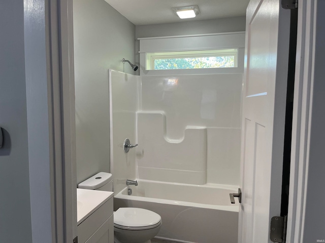 full bathroom with  shower combination, vanity, and toilet