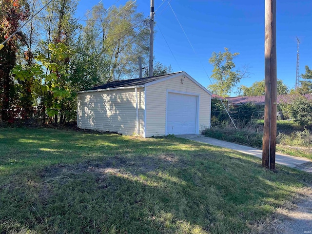 garage featuring a lawn