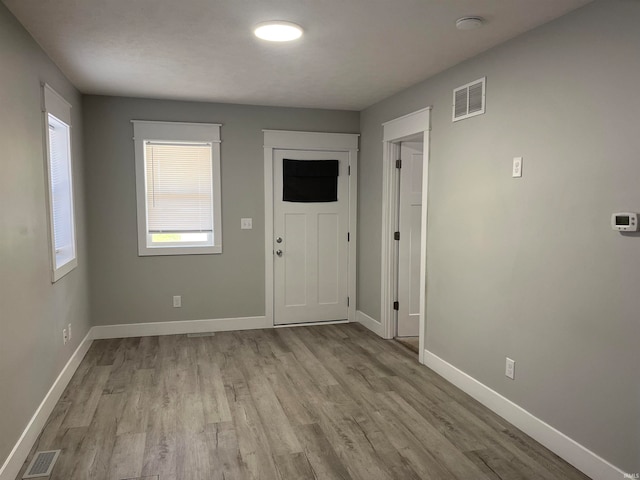 unfurnished room featuring light wood-type flooring