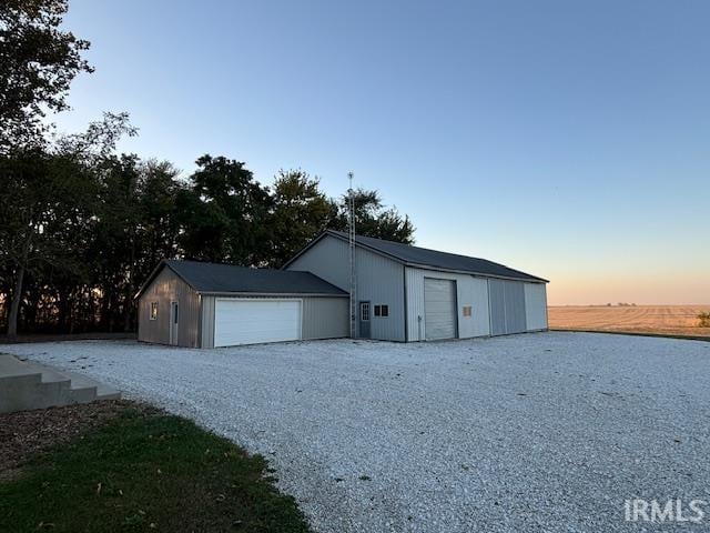 garage at dusk with a water view