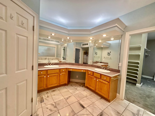 bathroom featuring ornamental molding and vanity