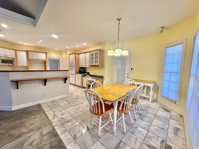 dining room with an inviting chandelier