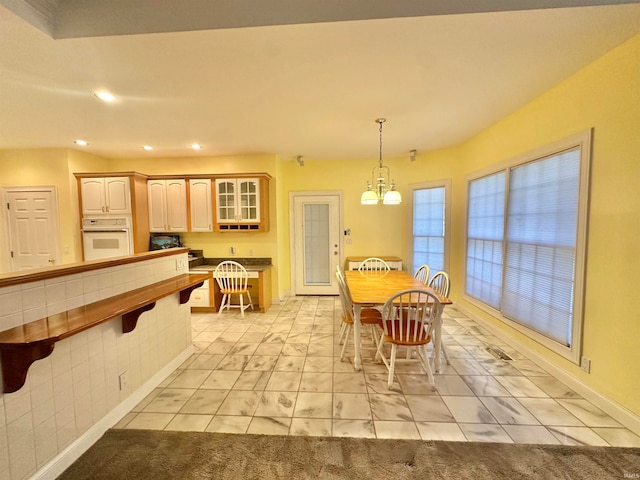 dining space with a notable chandelier