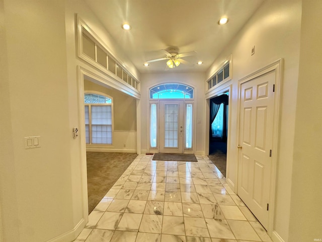 entryway with ceiling fan